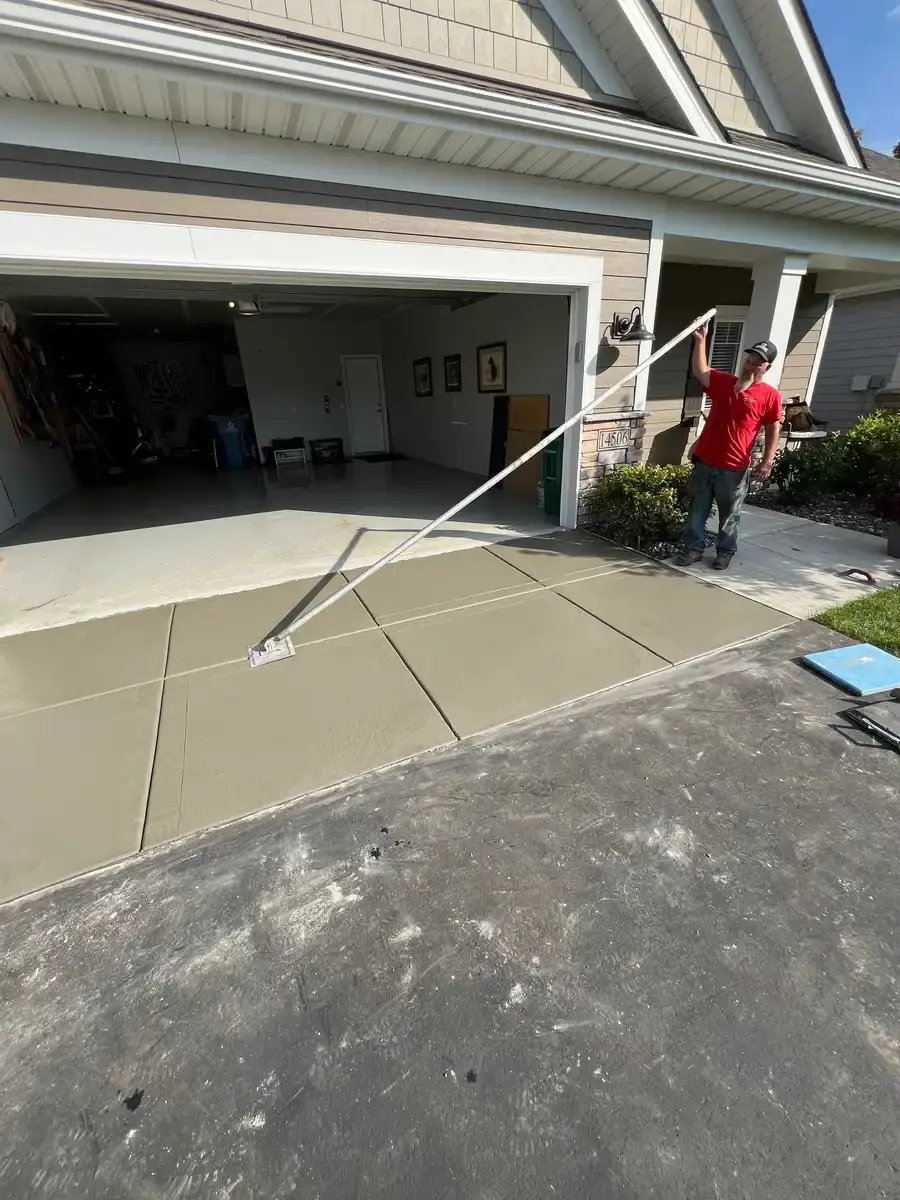 Concrete garage floor finishing in progress